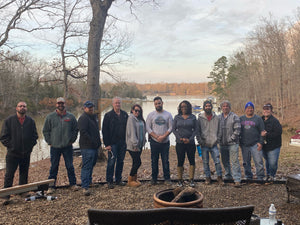 Black Female Gun Instructor With Students by Lake