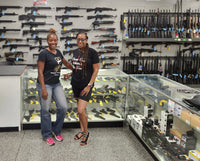 two black female firearms instructors at gun range